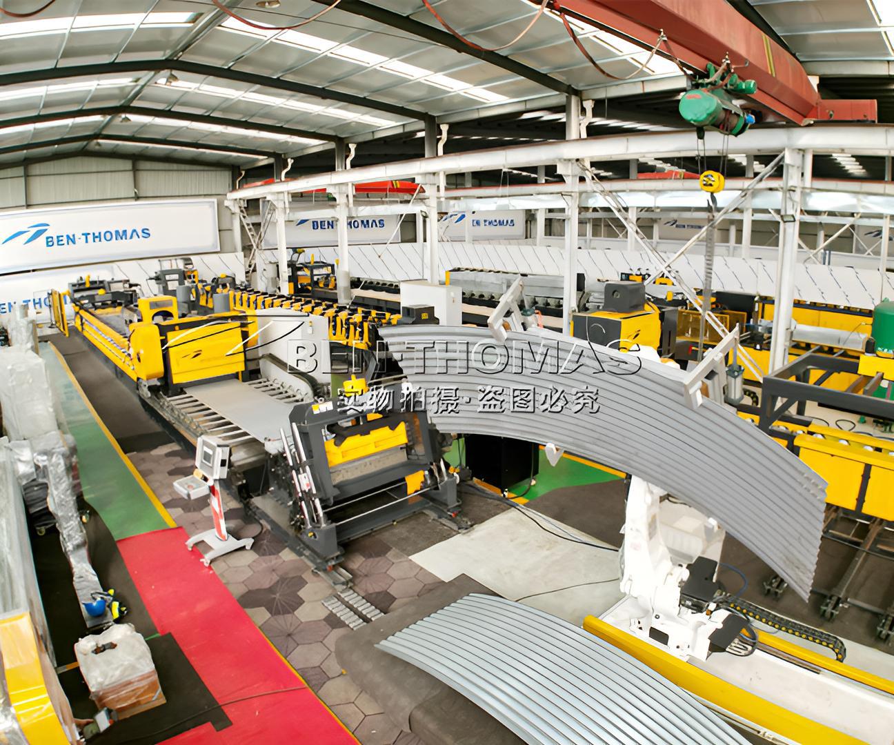 Metal silo sidewall sheet production line with robot receiving arm